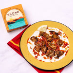 Plate of food with a box labeled 'Ekone' on a white background
