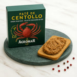 Agromar spider crab pate with a slice of bread on a green plate