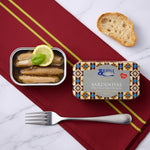 Tin of sardines with a slice of bread and lemon on a marble surface