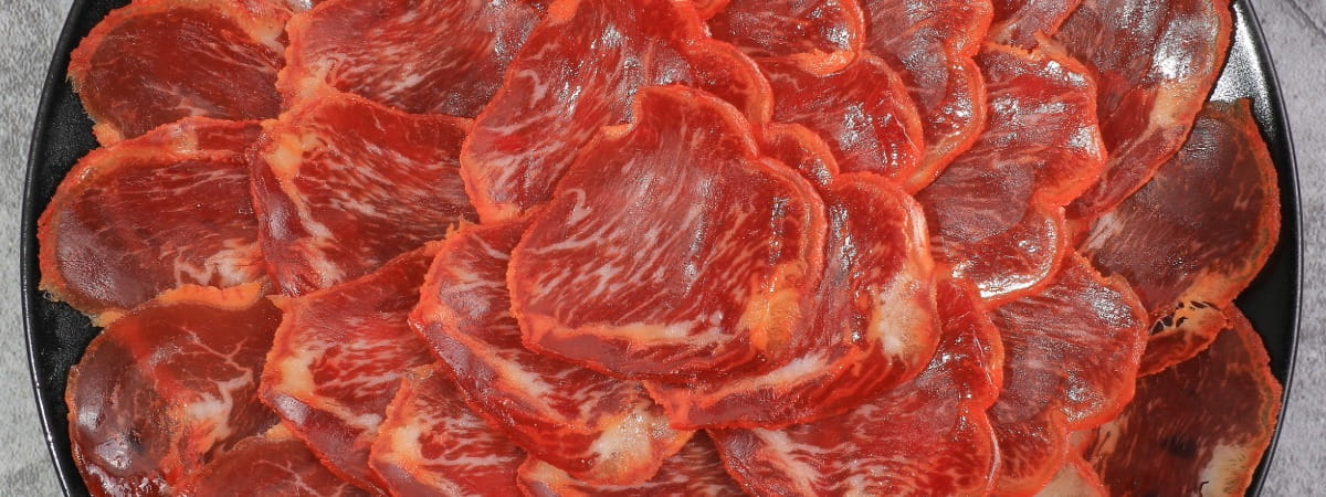 sliced lomo iberico with oil