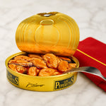 Open can of mussels Los Peperetes with a spoon inside, on a white background