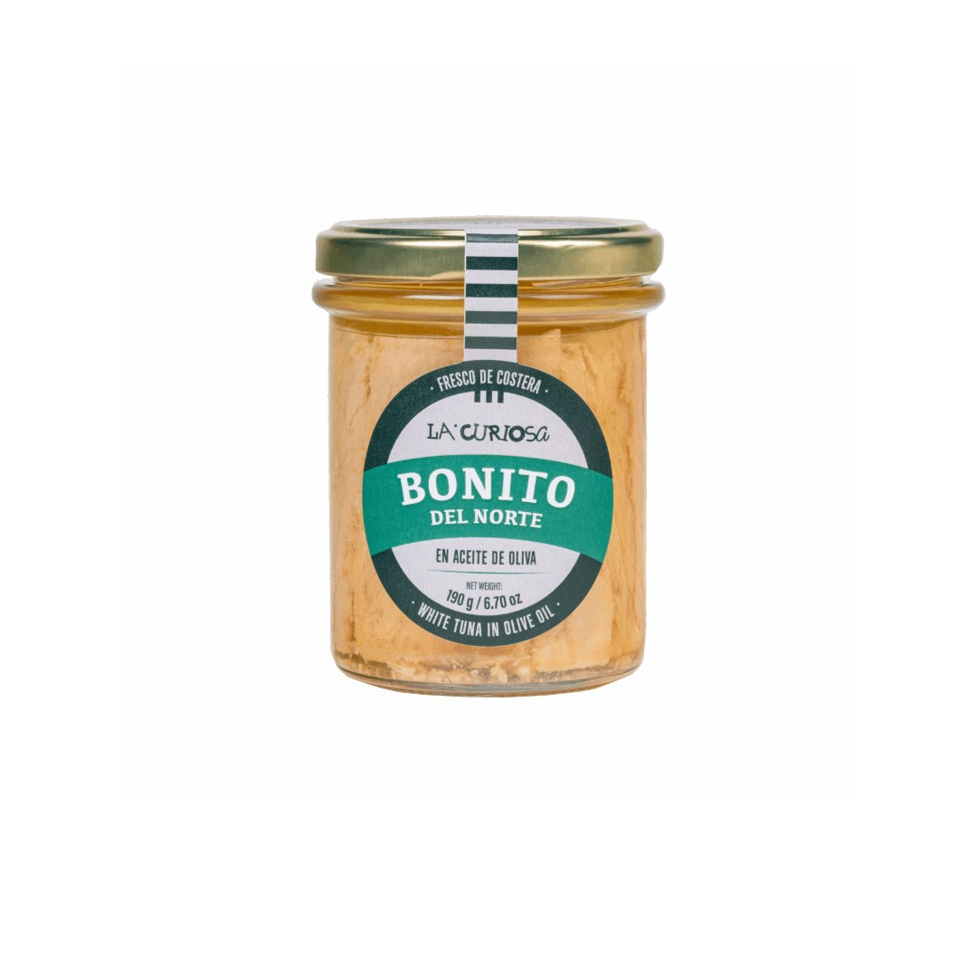Jar of 'Bonito del Norte' in olive oil with a green label on a white background