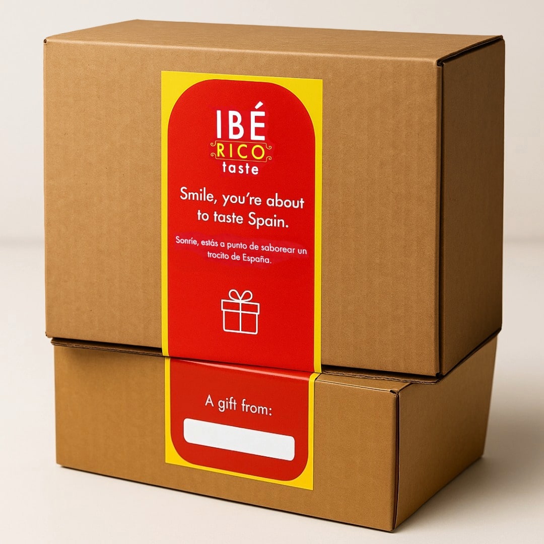 Brown gift box with a red label featuring the IBERICO Taste brand on a beige background
