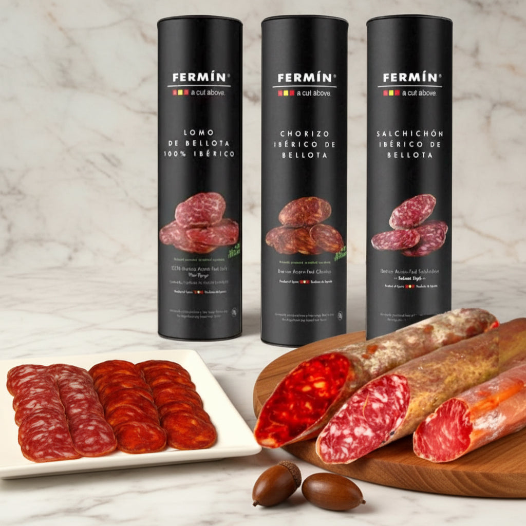 Three Fermin sausages packages with sliced sausages on a wooden background