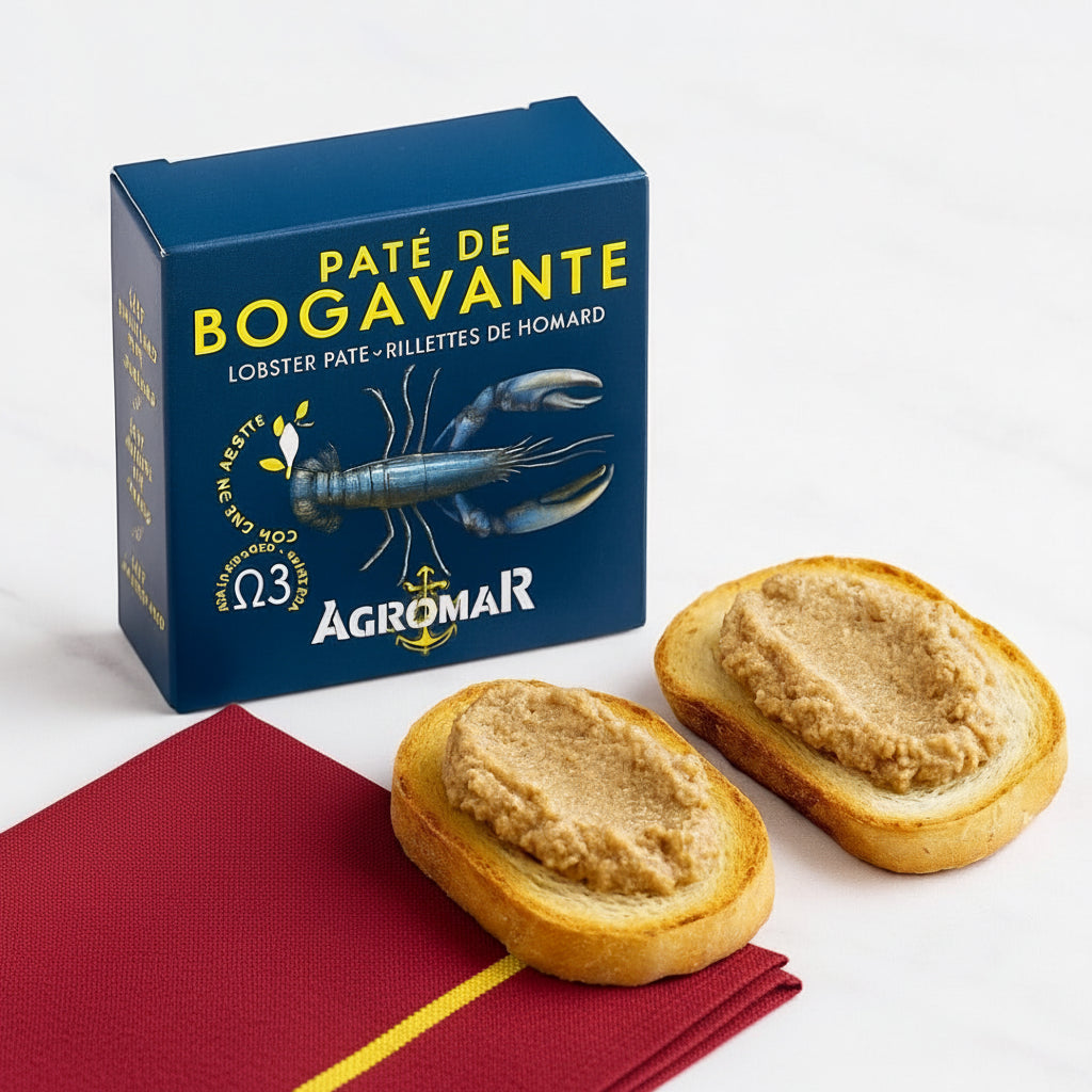 Box of Agromar lobster pate with two slices of bread spread with pate on a white background