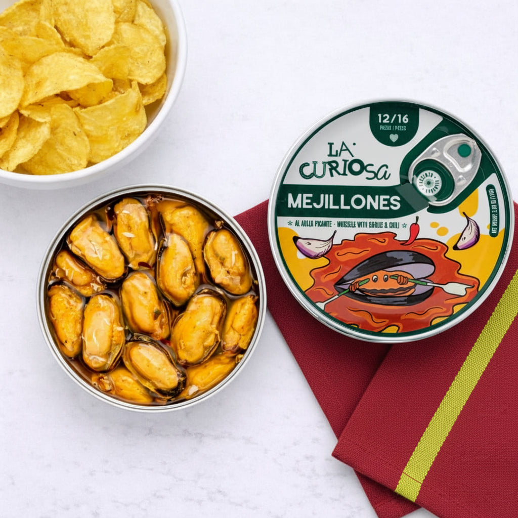 Can of mejillones with a bowl of chips on a white background