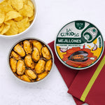 Can of mejillones with a bowl of chips on a white background