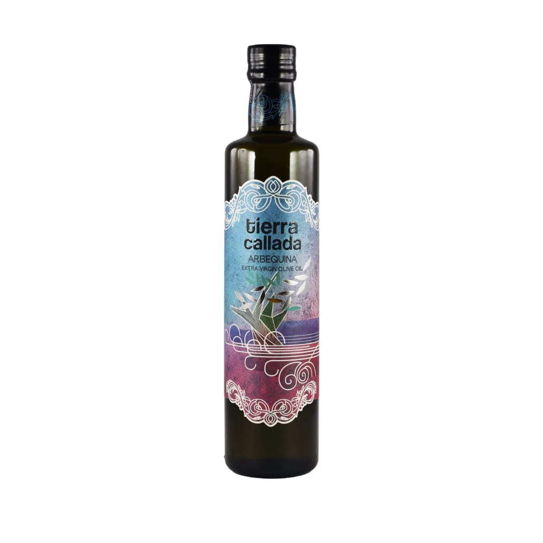 A bottle of Tierra Callada Arbequina Extra Virgin Olive Oil with a label featuring a poem by Miguel Hernández.