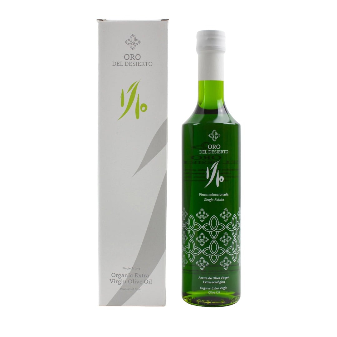 Green olive oil bottle with packaging on a white background