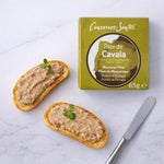 Conservas Santos Mackerel Pate with bread slices and a knife on a marble surface
