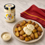 Bottle of traditional alioli sauce with baked potatoes