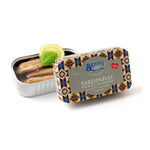 Tin of sardines with a decorative lid on a white background