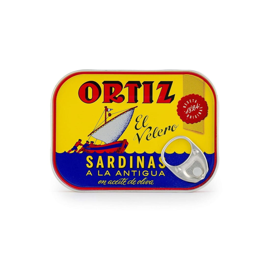Ortiz sardines can with colorful label featuring a boat illustration on a white background
