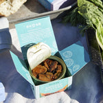 Open box containing a can of smoked oysters with Ekone branding.