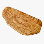 Wooden cutting board with a wavy grain pattern on a white background